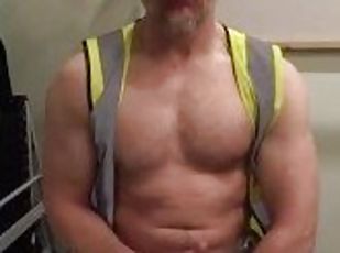 Muscular construction worker flexes and cums over his pecs