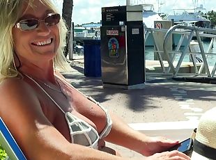 Horny milf with in a bikini fucks hard on a luxurious yacht