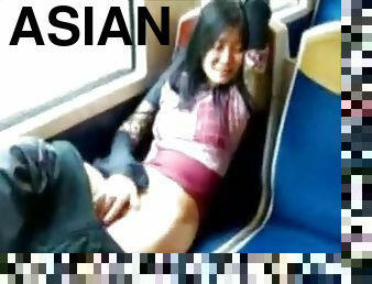 Asian milf masturbates pussy in the train