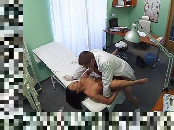 Naked female spreads legs for the horny physician who wants to check her