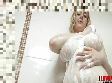 Curvy blonde with huge tits touching her hot body in the shower