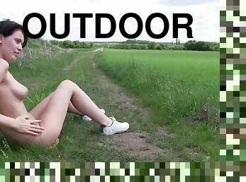 Teen stripping outdoors and slowly rubbing her shaved pussy