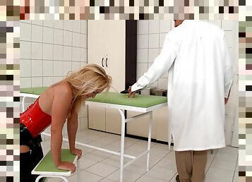 A latex wearing hottie is fucked by a doctor in a lab