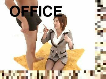 Office MILF admiring a co-worker's hard cock and sucking on it