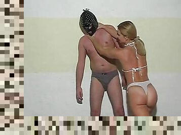 Masked dude being abused by a blonde bikini bombshell