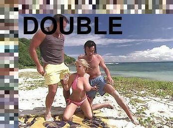 Cute blonde Jessica Moore enjoys a double penetration on a beach