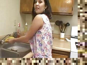 Latin houswife gives a blowjob to her busband in a kitchen