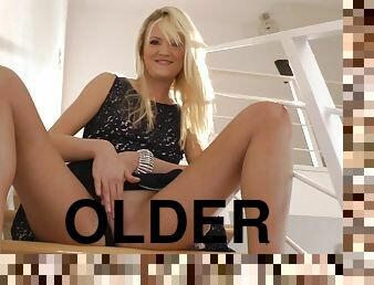 Hot blond rubs her shaved twat with her legs spread on stairs for old perve