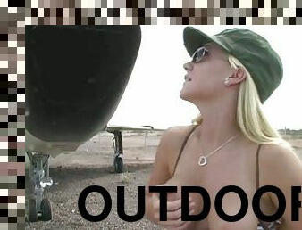 A blonde army girl shows her nice tits and a booty outdoors