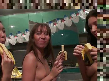 Lesbian babes eat some bananas before they masturbate with sex toys