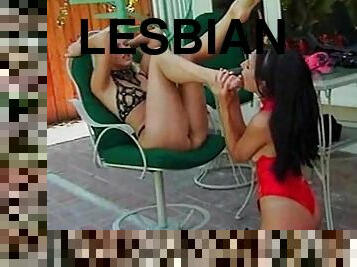 Lesbian fetish play outdoors with strapon sex