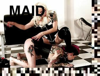 Two attractive maids with lots of tattoos playing with the sex toys