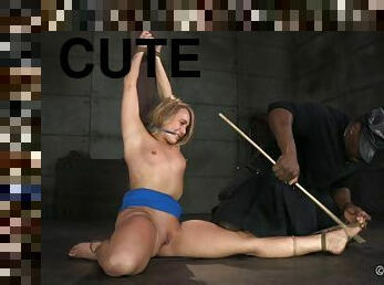 Cute and curvy blonde ball gagged and bound in the dungeon
