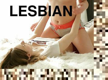 Kissing lesbian teens take their clothes off and fuck erotically