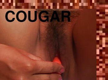 Appealing cougar with natural tits has a hairy shaved pussy as she enjoys dildo insertion