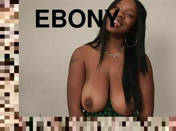 Adorable ebony solo model showcasing her big tits in a close up shoot