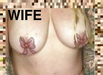 Tattooed housewife grinds against her magic wand and plays with her nipples.