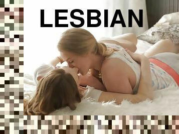 Teen lesbian couple makes erotic sex on the bed sheets