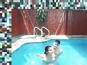 Three guys and one girl fuck in the pool