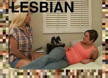 Well graced blondes wearing jeans are on bed and having a cute lesbians scene