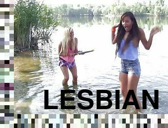 Wet chicks splashing in the lake and eating pussy on the shore