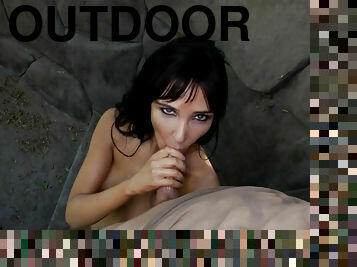Sexy Diana Prince with fake tits greedily sucks cock outdoors
