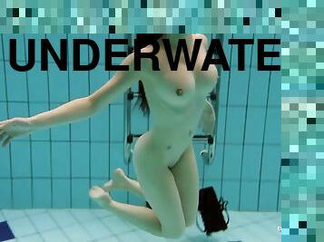 Kristy in a see through dress underwater