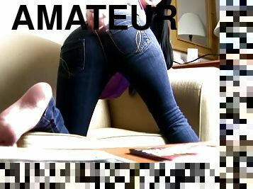 Brunette girl in jeans shakes her booty in webcam show