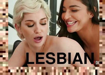 Emily Willis and Skye Blue licking passionately on the sofa