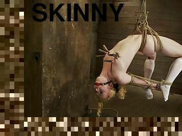 Skinny blonde in stockings gets tied up and tortured with clothespins