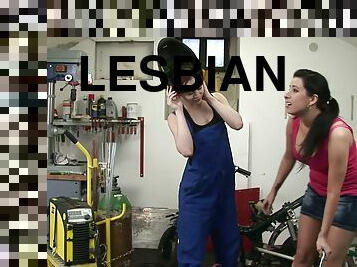 Horny babes have a lesbian moment in a garage