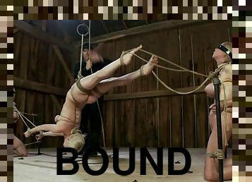 Three horny sex slaves are bound to each other in bondage