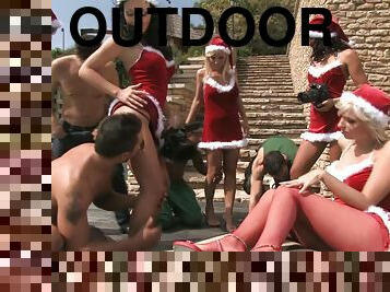 horny chicks in Xmas hats suck and ride dicks outdoors