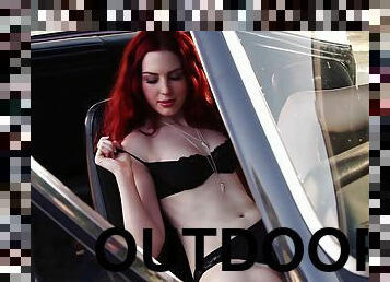 Redhead Alyssa Michelle poses in lingerie in a car