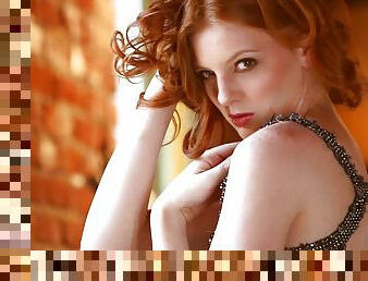 Shaun Tia the redhead model poses naked by the window