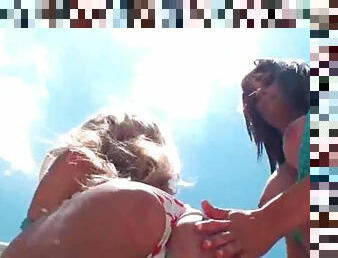 Outdoor hot lesbo scene with two girls in swim suits