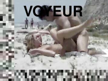 Voyeurs on the beach is spying around for hotties