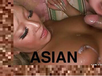 Asian blonde slut gets jizzed on her boobs in close-up