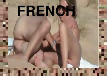 French wife lets her hubby finger her cunt on a beach