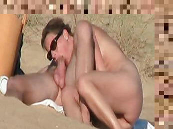 Horny French dude gets his cock rubbed by his GF on a beach