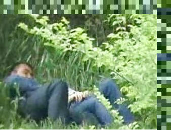 Horny couple feels an urge to caress each other in a park