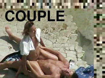 Horny couple banging on a beach caught on a voyeur's cam