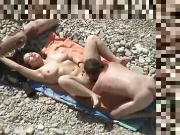 Sexy babe is getting a huge cock of her boyfriend on the beach