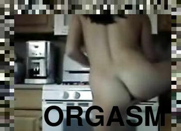 Hot Babe Cooks Up An Orgasm Masturbating In The Kitchen