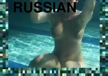 Russian solo model with big tits enjoying cozy pool