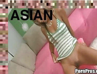 Sassy Asian damsel with long hair thrilled as she rides a stiff dong