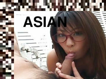 Wild Asian Girl with Glasses Gives a Guy an Outdoor Blowjob