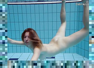 Sassy solo model teen loves displaying her nice ass in pool