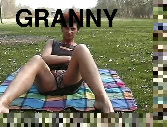 Short-haired Dutch granny goes outside to do the masturbation