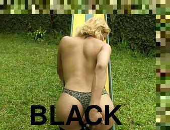 Tranny blonde models her sexy black stockings outdoors